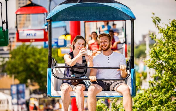 Summerfest attendees ride the skyglider.
